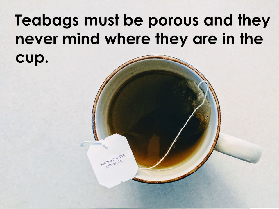 A teabag must be porous. They never mind where they are in the cup.